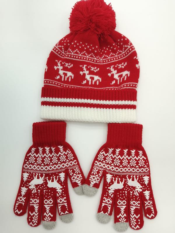 Röd och vit Fair Isle-stickad vintermössa med pompom och matchande renhandskar på vit bakgrund.