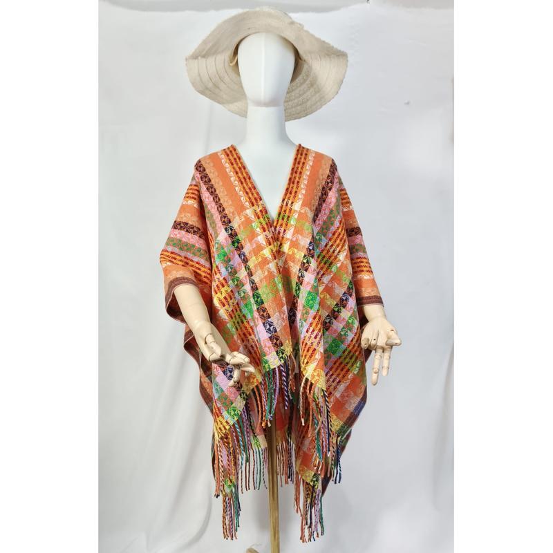Orange handvävd poncho med geometriskt mönster