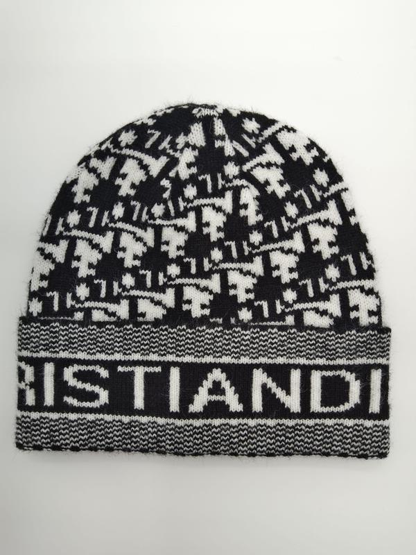 Svart-vit houndstooth-mönstrad stickad mössa med ribbad logomanchett